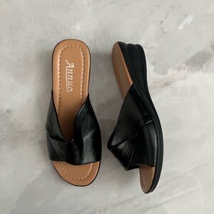 Black leather slide sandals with a chunky heel
